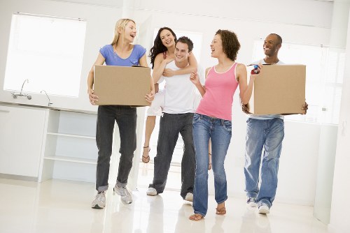 Packed moving boxes and furniture ready for transport in Tooting