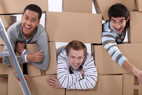 Moving team loading household items into a removal van in Tooting