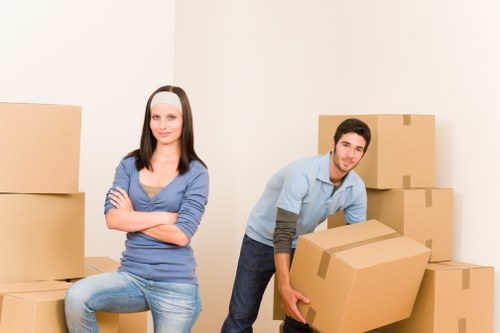 A trained van moving crew handling furniture carefully