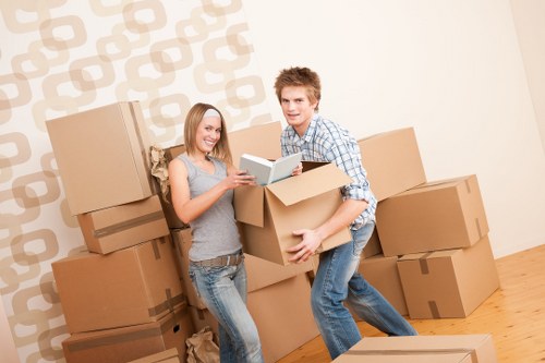 Packed moving boxes and furniture in a Tooting property